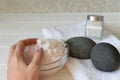 Hands with crystals of white sea salt. Atmosphere of relaxation Royalty Free Stock Photo