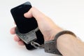 Hands cuffed phone Royalty Free Stock Photo