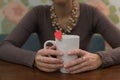 hands with a cup and heart