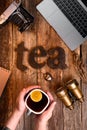 The word tea spelled using brown letters on the wooden table. Royalty Free Stock Photo