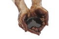 Hands cupped with black oil Royalty Free Stock Photo