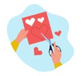 Hands cut hearts out of red paper. Hand hold scissors. Origami and crafts, celebration valentine day, making postcard or