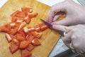 Hands cut red pepper with a knife Royalty Free Stock Photo