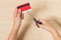 Hands cutting a credit card with scissors Royalty Free Stock Photo