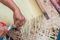 Hands cutting mat weaving. Royalty Free Stock Photo