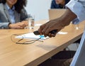 Hands-On Demonstration of Wireless Charging Technology in a Business Meeting Royalty Free Stock Photo
