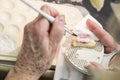 Hands of Dental Technician Applying Porcelain To 3D Printed Implant Mold Royalty Free Stock Photo