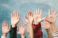 Hands of different people raised up on background Royalty Free Stock Photo