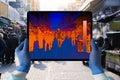 Hands with digital tablet with a thermal imager