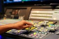 Hands on dissolve of Switcher buttons in studio TV station, Audi