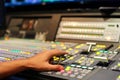 Hands on dissolve of Switcher buttons in studio TV station, Audi