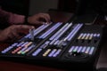 Hands on dissolve of Switcher buttons in studio TV station, Audio and Video Production Switcher of T