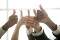 Hands of diverse business team showing thumbs up, closeup view Royalty Free Stock Photo