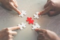 Hands of diverse people assembling jigsaw puzzle, help support Royalty Free Stock Photo