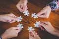 Hands of diverse people assembling jigsaw puzzle, Youth team put Royalty Free Stock Photo