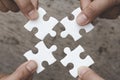 Hands of diverse people assembling jigsaw puzzle, Youth team put pieces together searching for right match, help support in Royalty Free Stock Photo