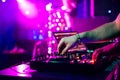 Hands DJ mixing and playing music on a professional controller mixer Royalty Free Stock Photo