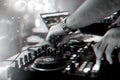 Hands DJ mixing and playing music on a professional controller mixer Royalty Free Stock Photo