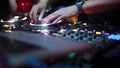Close up of hands of DJ plays music mixing and scratching on turntable music equipment. Professional music equipment