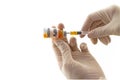 Hands of the doctor filling a vaccine syringe and bottle vaccine of Human papillomavirus (HPV) vaccine on white