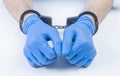 Hands of a doctor in handcuffs. The concept of corruption in medicine