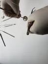 hands of doctor with white latex gloves using dental tools for oral inspection Royalty Free Stock Photo