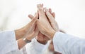 Hands, doctors and group high five in closeup for motivation, success or team building in hospital. Doctor, teamwork and