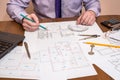 Hands drawing with architecture with measuring instruments and laptop Royalty Free Stock Photo