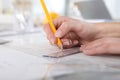 Hands drawing with pencil and ruler, close up Royalty Free Stock Photo