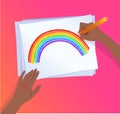 Hands drawing rainbow arc with pencil