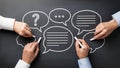 Hands Drawing Speech Bubbles on Chalkboard for Communication and Discussion Royalty Free Stock Photo