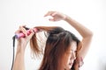 Hands drying woman hair with equipment. Royalty Free Stock Photo