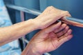 The hands of elderly old woman as grab at the edge of the bed Royalty Free Stock Photo