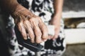 The hands of an elderly woman have curly fingers and wrinkled, holding the old cane sitting alone Royalty Free Stock Photo