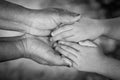 Hands of an elderly woman holding the hand of a younger woman Royalty Free Stock Photo