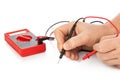 Hands and electric multimeter Royalty Free Stock Photo