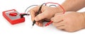 Hands and electric multimeter Royalty Free Stock Photo