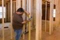 Hands of electrician installing electrical socket in new apartment Royalty Free Stock Photo