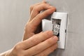 Hands of electrician installing light switch Royalty Free Stock Photo