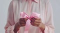 The hands holding pink ribbon.AI generated image Royalty Free Stock Photo