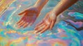 Hands Emerging From A Pool Of Iridescent Paints Royalty Free Stock Photo