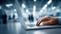 Hands are engaged in typing on a laptop keyboard at a desk in an office environment, focusing on work or study tasks Royalty Free Stock Photo