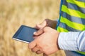 Hands of an engineer close-up, holding a tablet in his hands, close-up of male hands holding a tablet, agronomist engineer in the