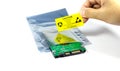 Hands of the engineers who are labeling the ESD protection label on the bag,The yellow CAUTION label for Electrostatic Sensitive