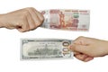 Hands exchange rubles for dollars.