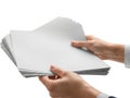 Hands exchange a stack of blank paper sheets Royalty Free Stock Photo