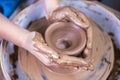 Hands of Experienced Female Potter Working with Clay. Posing with Clay Lump on Potter`s Wheel in Workshop Royalty Free Stock Photo