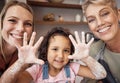 Hands, family and children with a girl baking in the kitchen of her home with mother and grandmother. Kids, cooking and Royalty Free Stock Photo
