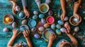 Hands of family dyeing easter eggs with vibrant colors on a wooden table
