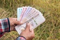 Hands farmer are holding thai banknote in rice field, money thai baht in hand farmer, hand are holding money banknote of thailand Royalty Free Stock Photo